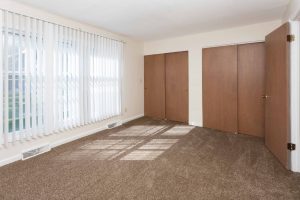 Bedroom with large closets at Fountainview East Apartments.