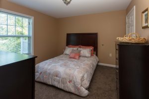 Meyer Pointe senior apartment's for rent near me furnished bedroom.