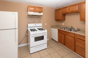 Kitchen with appliances, sink, and cabinet space at the Bellreng Apartments.
