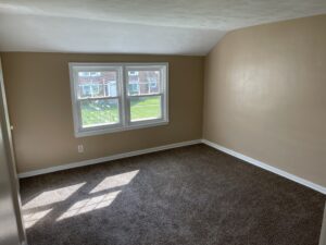 Large bedroom inside of Milpine Garden townhomes for rent.