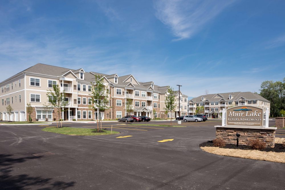 Muir Lake's entire luxury apartments community with parking lot.