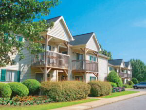 Bushes around apartment buildings.