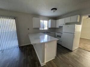 Kitchen space with white cabinets at the Nottingham Apartments in Greensboro, North Carolina.